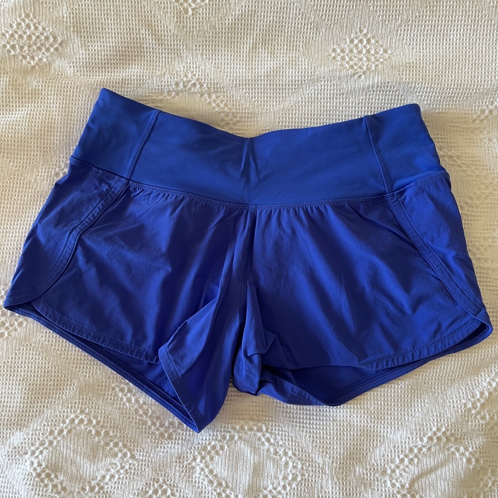 Like new, Lululemon, size 4, blue shorts, back pocket, no inside liner